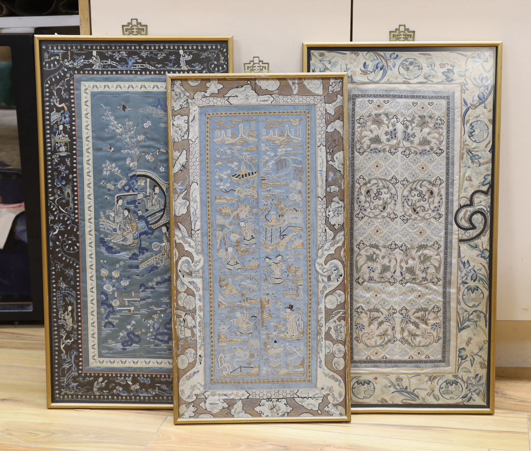 Three framed pairs of 19th century Chinese silk embroidered sleeve bands, two pairs worked in Chinese knot, largest 36cm wide, 72cm high